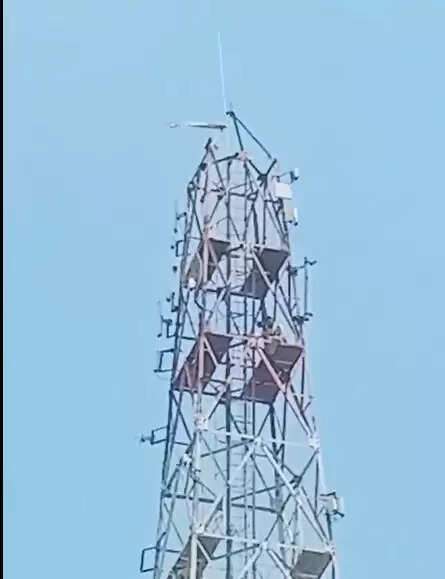 climbing a telephone tower